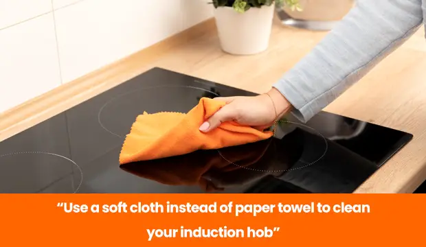 clean induction hob with soft cloth not paper towel