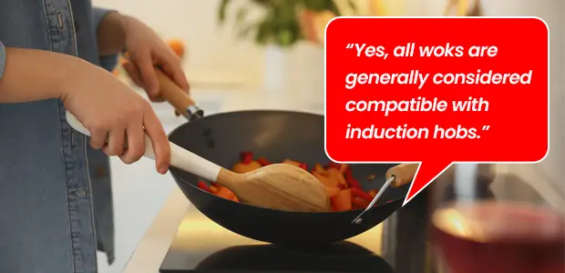 woman using wok on an induction hob