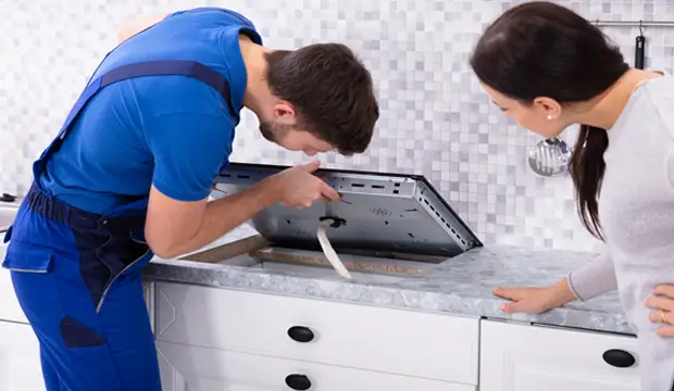 You can install an induction hob above cutlery drawer